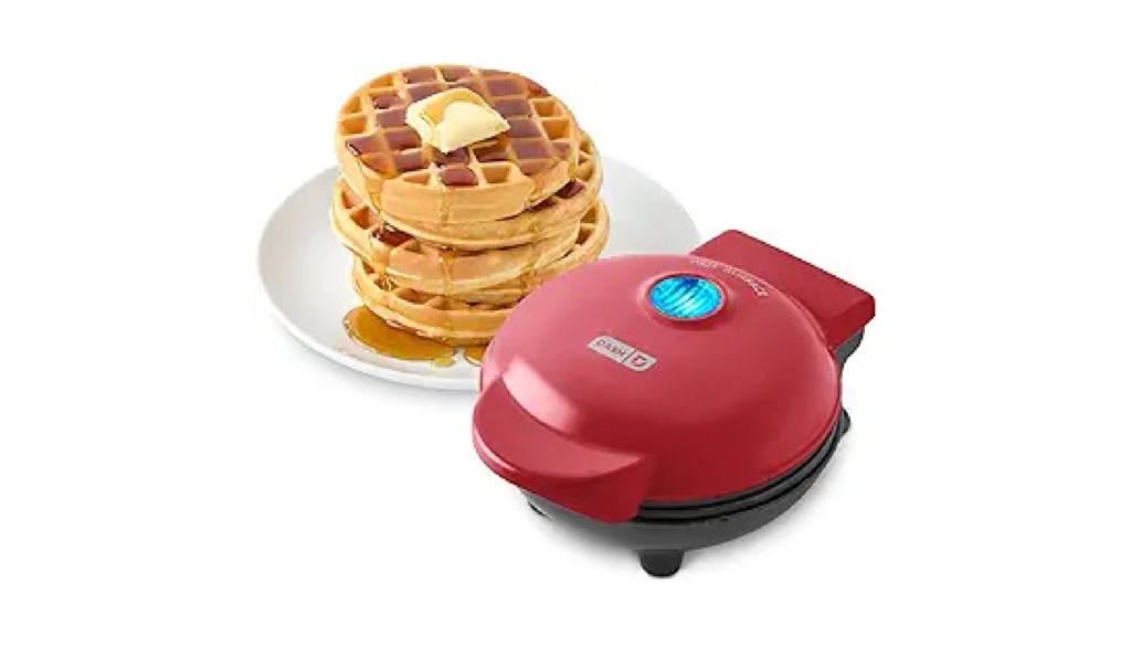 Dash mini waffle maker cooking a single golden waffle