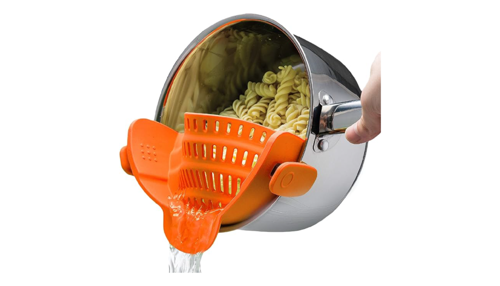 Green Snap N Strain strainer clipped onto a saucepan of pasta