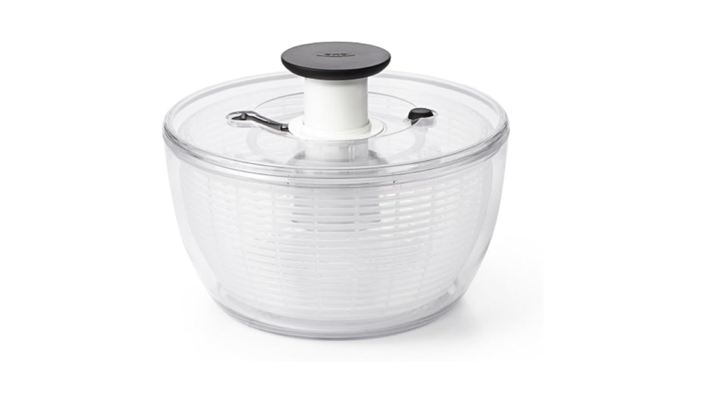Green salad spinning inside the OXO Good Grips spinner