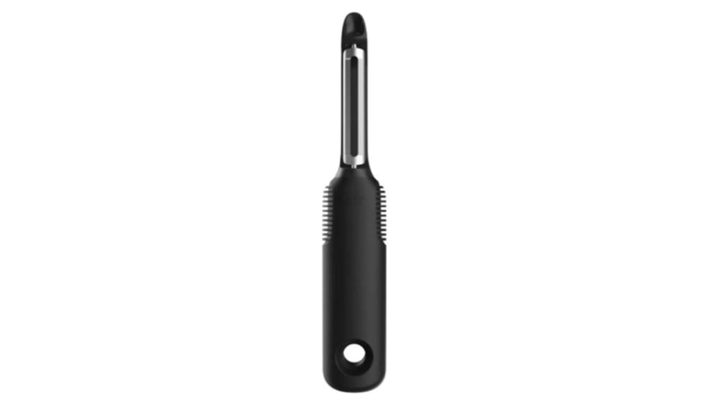 OXO swivel peeler removing carrot skin
